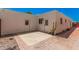Backyard patio with brick and concrete, offering multiple doors to enter the home at 5314 N Las Casitas Pl, Phoenix, AZ 85016