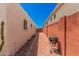 Backyard patio alley with brick, a bbq and cacti at 5314 N Las Casitas Pl, Phoenix, AZ 85016