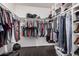 An organized walk-in closet with shelves and hanging racks at 5314 N Las Casitas Pl, Phoenix, AZ 85016