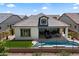 Aerial view of a home with a backyard featuring a pool, covered patio, and well-manicured landscaping at 5724 E Scarlet St, Mesa, AZ 85215
