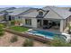 An elevated view showcases a backyard featuring a pool, patio, and cozy seating area at 5724 E Scarlet St, Mesa, AZ 85215