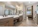 Bathroom featuring dual sinks, modern fixtures, and a vanity area, with a bedroom view at 5724 E Scarlet St, Mesa, AZ 85215