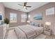 Serene bedroom with soft lighting, neutral tones, and plantation shutters, creating a relaxing retreat at 5724 E Scarlet St, Mesa, AZ 85215