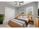 Inviting bedroom with a wooden bed frame, stylish decor, and ample natural light, creating a cozy atmosphere at 5724 E Scarlet St, Mesa, AZ 85215