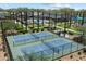 Overhead view of the community pickleball courts, pool, and common areas with palm trees at 5724 E Scarlet St, Mesa, AZ 85215