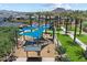 Overhead view of the community playground with shaded play area, common areas, and green landscaping at 5724 E Scarlet St, Mesa, AZ 85215
