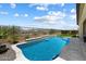 Stunning backyard with a refreshing pool, manicured landscaping, and privacy fencing for outdoor enjoyment at 5724 E Scarlet St, Mesa, AZ 85215