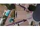 Aerial view of a single-Gathering house showcasing its backyard, surrounded by neighboring homes, with a private driveway at 635 S Lanus Dr, Gilbert, AZ 85296