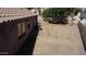 View of the expansive backyard with sparse landscaping and shade trees at 635 S Lanus Dr, Gilbert, AZ 85296