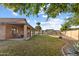 Spacious backyard with a covered patio and a fenced pool at 635 S Lanus Dr, Gilbert, AZ 85296