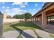 Large backyard with patio area and plenty of green space and foliage at 635 S Lanus Dr, Gilbert, AZ 85296