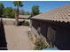 The side yard features xeriscape landscaping with mature landscaping and trees at 635 S Lanus Dr, Gilbert, AZ 85296