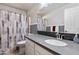 Bathroom featuring modern sink, new tile, and updated fixtures at 635 S Lanus Dr, Gilbert, AZ 85296