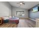 Large main bedroom featuring vaulted ceilings, wood floors, and a ceiling fan at 635 S Lanus Dr, Gilbert, AZ 85296