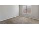 Neutral carpeted bedroom with ample light from a window at 635 S Lanus Dr, Gilbert, AZ 85296