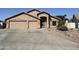 Charming single-story home featuring a spacious driveway and desert landscaping at 635 S Lanus Dr, Gilbert, AZ 85296