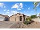 Charming single-story home with a three-car garage, desert landscaping, and a welcoming entrance at 635 S Lanus Dr, Gilbert, AZ 85296
