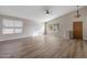 Spacious living room with vaulted ceilings, ceiling fan and wood-look flooring at 635 S Lanus Dr, Gilbert, AZ 85296