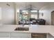 Cozy living room adjacent to the kitchen and features sliding doors to the backyard and vaulted ceilings at 635 S Lanus Dr, Gilbert, AZ 85296