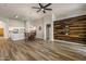 Spacious living room features hardwood floors, vaulted ceilings, and a wood accent wall at 635 S Lanus Dr, Gilbert, AZ 85296