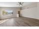 Inviting living room with vaulted ceilings, wood-look floors and a large window at 635 S Lanus Dr, Gilbert, AZ 85296