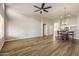 Open living room features hardwood floors, vaulted ceilings, modern lighting and a wood accent wall at 635 S Lanus Dr, Gilbert, AZ 85296