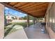 Covered patio overlooking the expansive backyard and privacy fence, with room for outdoor dining and grilling at 635 S Lanus Dr, Gilbert, AZ 85296