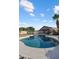 Refreshing pool with crystal clear water surrounded by rock features at 635 S Lanus Dr, Gilbert, AZ 85296