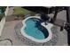 Kidney shaped pool with a fenced area and a lounge chair for relaxing and shaded seating with easy access from the lawn at 635 S Lanus Dr, Gilbert, AZ 85296