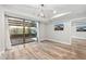 Bright bedroom featuring wood floors, recessed lighting, and access to an outdoor patio at 7117 E Rancho Vista Dr # 3010, Scottsdale, AZ 85251