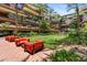 This property features a putting green, palm trees, outdoor seating and lush landscaping at 7117 E Rancho Vista Dr # 3010, Scottsdale, AZ 85251