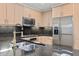 Kitchen with stainless steel appliances and granite countertops at 7117 E Rancho Vista Dr # 3010, Scottsdale, AZ 85251