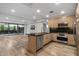 Kitchen features wood floors, island, and modern appliances at 7117 E Rancho Vista Dr # 3010, Scottsdale, AZ 85251