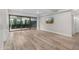 Open concept living room featuring wood floors, recessed lighting, and an outdoor patio at 7117 E Rancho Vista Dr # 3010, Scottsdale, AZ 85251