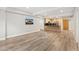 Spacious living room featuring wood floors, recessed lighting, and modern kitchen at 7117 E Rancho Vista Dr # 3010, Scottsdale, AZ 85251