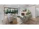 Open concept living room featuring stylish furniture, wood floors, recessed lighting, and an outdoor patio at 7117 E Rancho Vista Dr # 3010, Scottsdale, AZ 85251