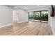 Open concept living room featuring wood floors, recessed lighting, and access to an outdoor patio at 7117 E Rancho Vista Dr # 3010, Scottsdale, AZ 85251
