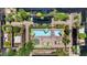 Aerial view of the community pool, featuring lounge chairs, umbrellas and lush landscaping at 7117 E Rancho Vista Dr # 3010, Scottsdale, AZ 85251