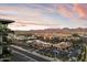 Aerial view showcasing the neighborhood with vibrant shopping and dining options, with mountains in the distance at 7180 E Kierland Blvd # 1116, Scottsdale, AZ 85254