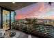 Balcony with seating offering stunning views of the city skyline at sunset at 7180 E Kierland Blvd # 1116, Scottsdale, AZ 85254
