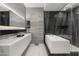 The minimalist bathroom boasts a soaking tub, glass shower, and floating vanity, providing a spa-like retreat in a modern setting at 7180 E Kierland Blvd # 1116, Scottsdale, AZ 85254