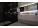 Modern bathroom featuring a spacious shower and sleek vanity with contemporary lighting at 7180 E Kierland Blvd # 1116, Scottsdale, AZ 85254