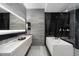 Modern bathroom with a soaking tub, walk-in shower, and sleek vanity at 7180 E Kierland Blvd # 1116, Scottsdale, AZ 85254