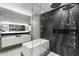 Contemporary bathroom with a deep soaking tub, stylish fixtures, and elegant marble wall at 7180 E Kierland Blvd # 1116, Scottsdale, AZ 85254