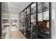 Modern closet with glass doors featuring ample storage for clothes, shoes, and accessories at 7180 E Kierland Blvd # 1116, Scottsdale, AZ 85254