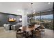 Spacious dining room with modern lighting and expansive views of the city and mountains through large windows at 7180 E Kierland Blvd # 1116, Scottsdale, AZ 85254