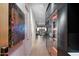 Modern hallway featuring hardwood floors and a wine cellar at 7180 E Kierland Blvd # 1116, Scottsdale, AZ 85254