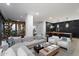 Bright living room with modern decor, large sectional sofa, and open layout to the kitchen area at 7180 E Kierland Blvd # 1116, Scottsdale, AZ 85254
