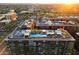 Stunning aerial view of rooftop pools and landscaping at sunset at 7180 E Kierland Blvd # 1116, Scottsdale, AZ 85254