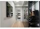 Well-organized walk-in closet with custom shelving and a view to a serene bathroom at 7180 E Kierland Blvd # 1116, Scottsdale, AZ 85254